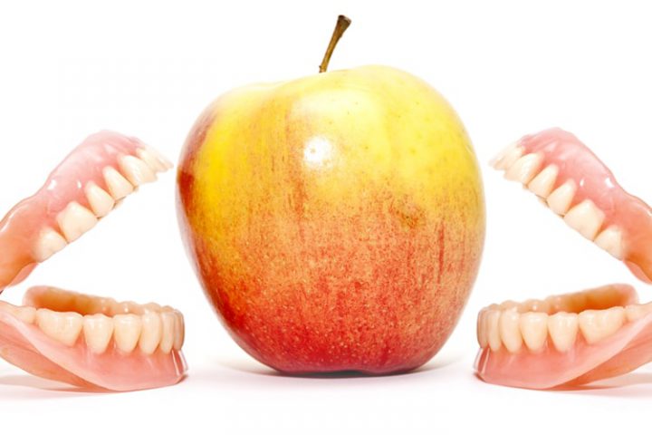 dentures eating apple