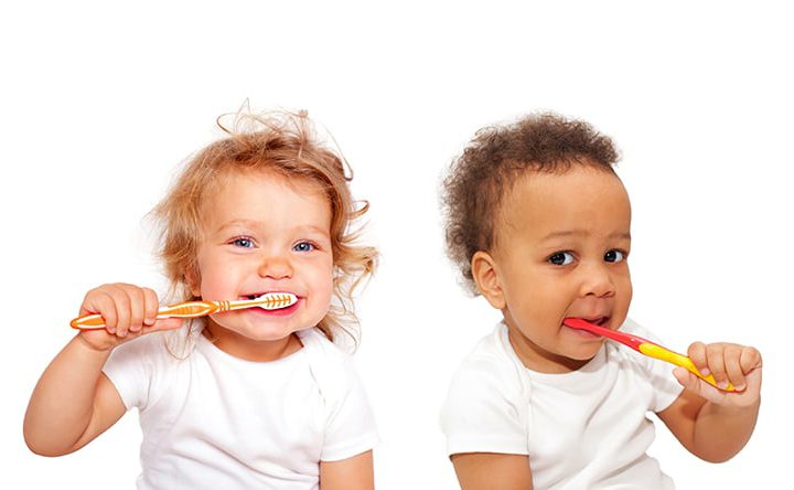 babies brushing teeth