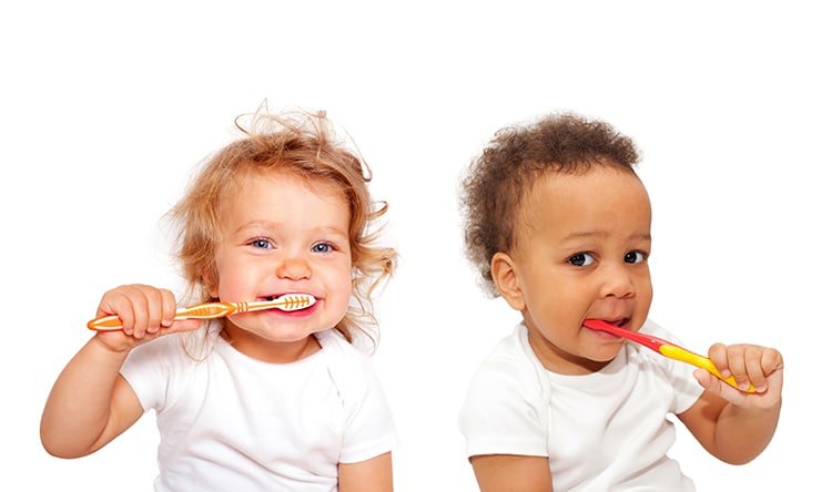 babies brushing teeth