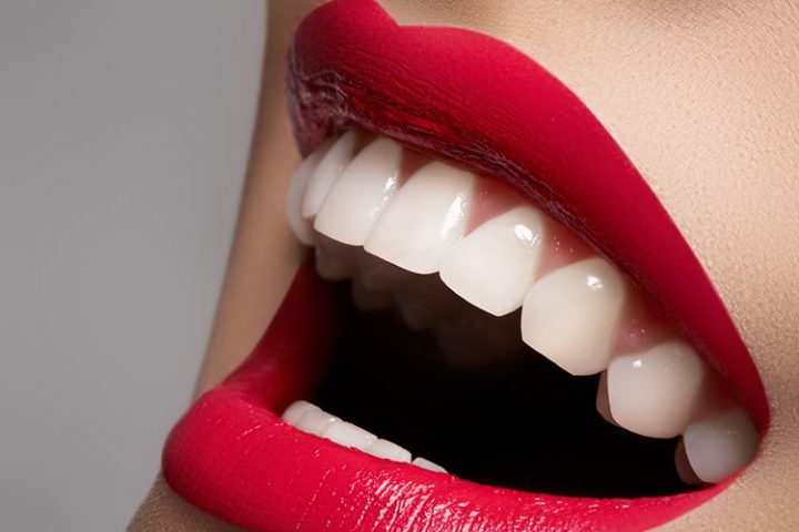 Beautiful white teeth and red lips
